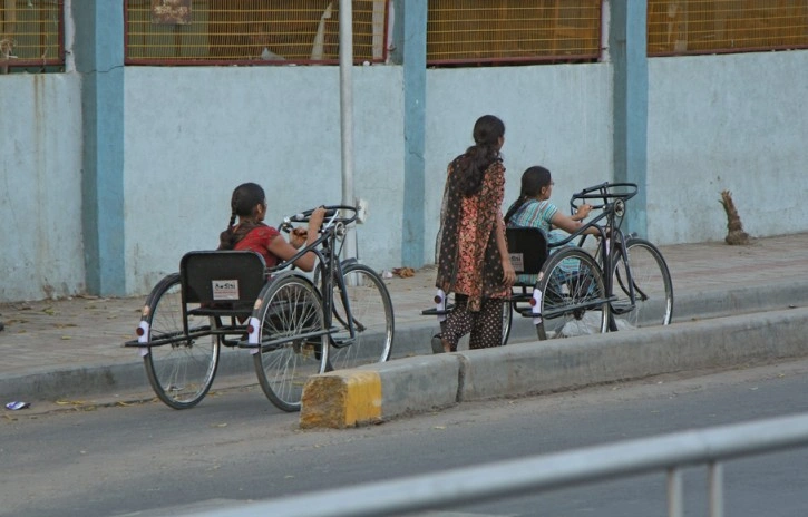 Two people in a wheelchair