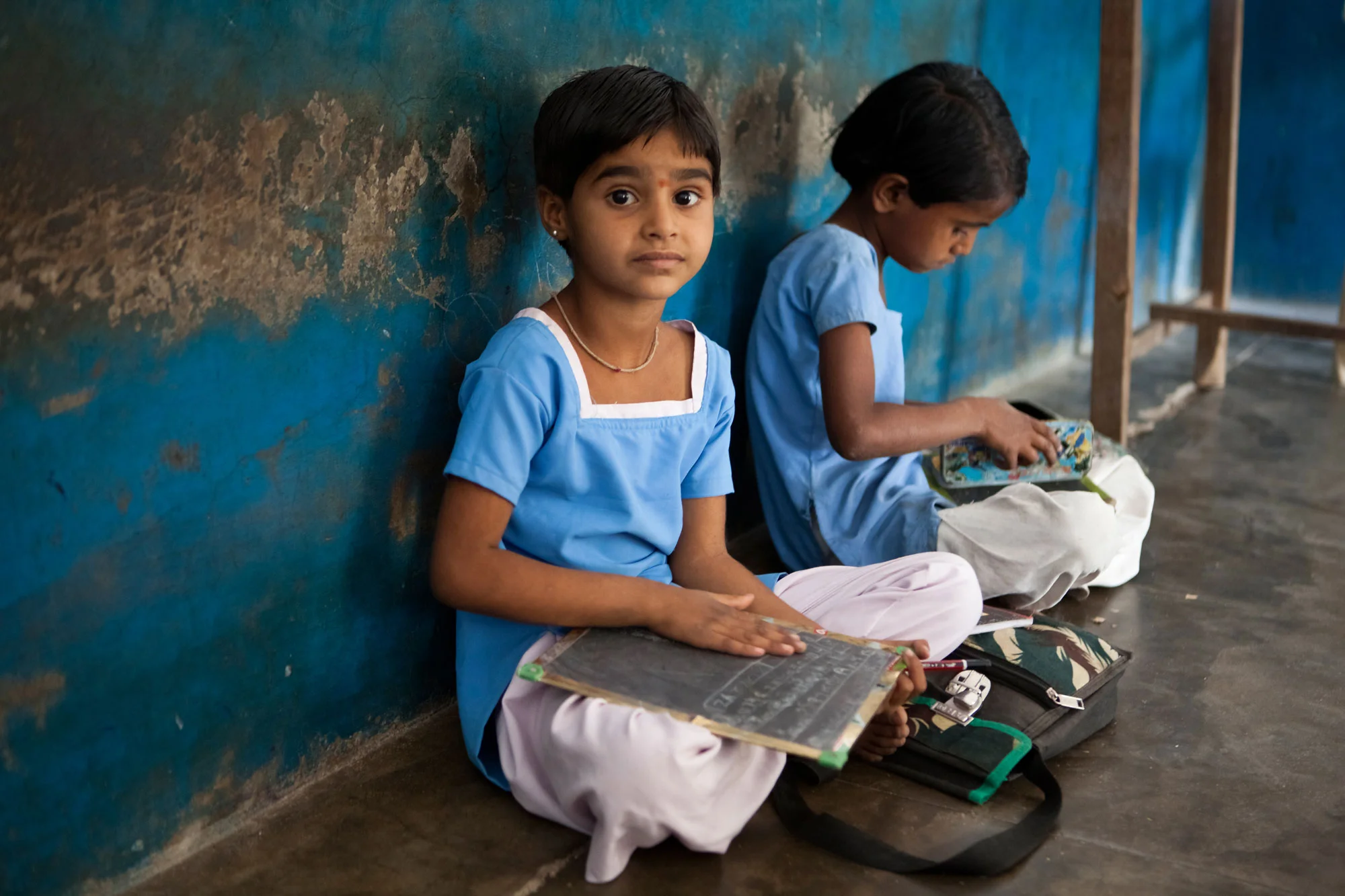 Two young government girls studying