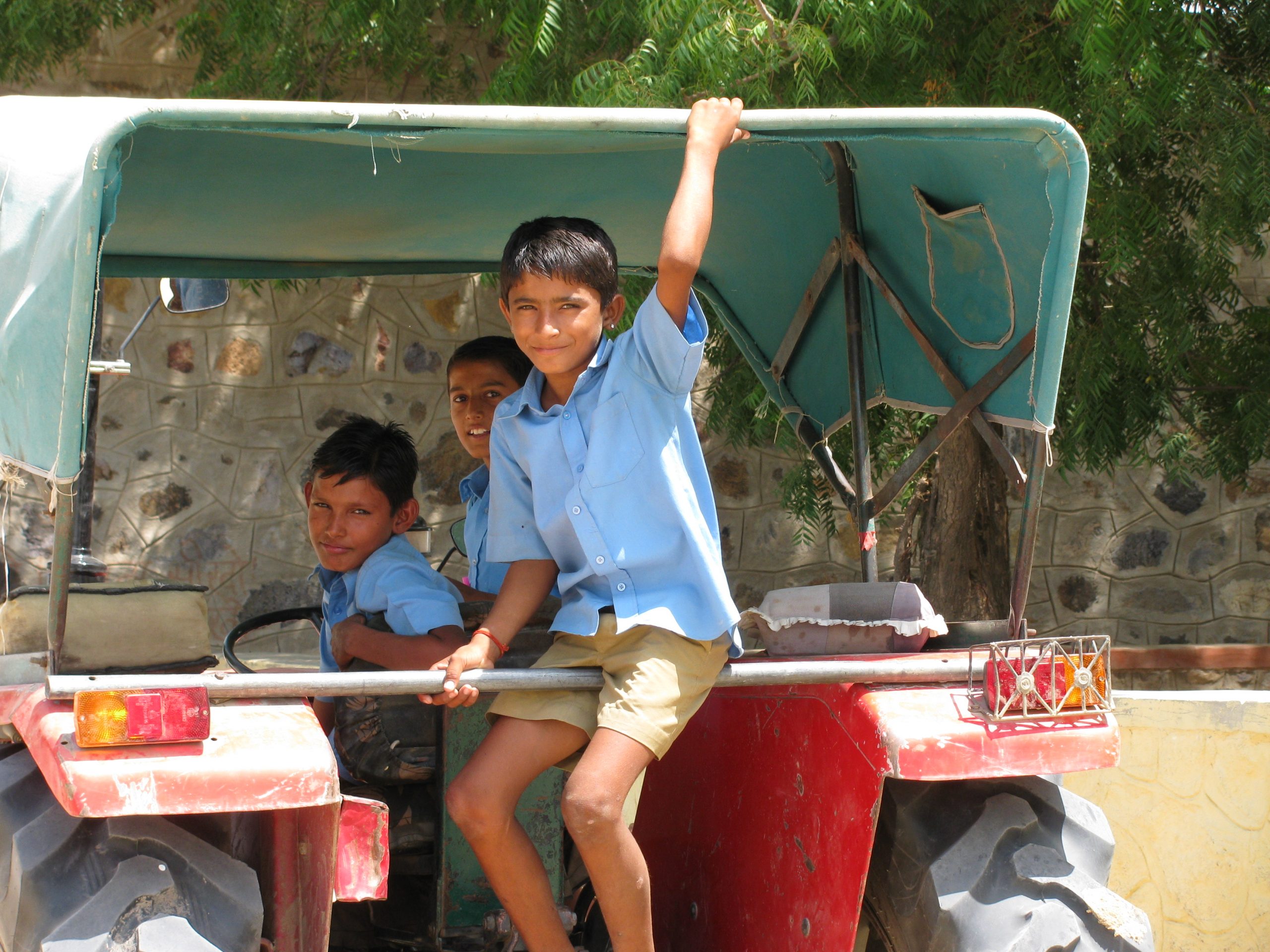 Social sector fellowship boys sitting on the back of a truck in rajasthan