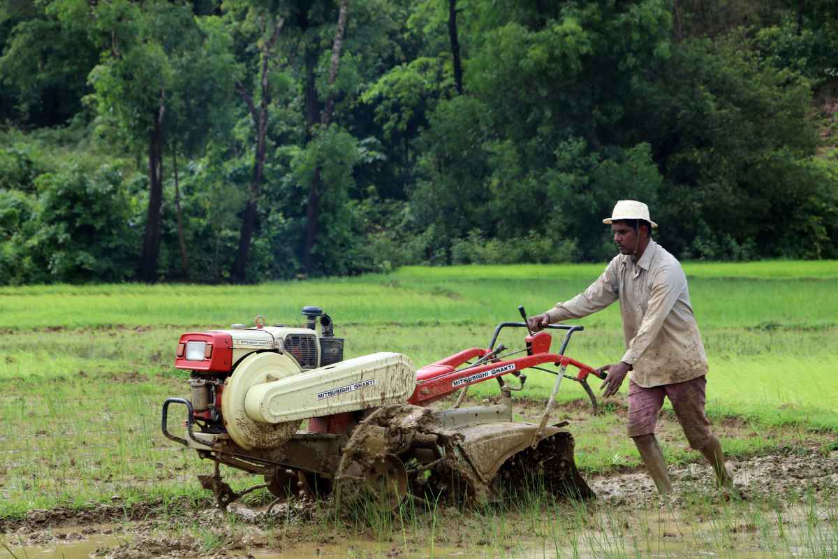 image of a farmer cultivating his land using a machine in sindhudurg-agriculture