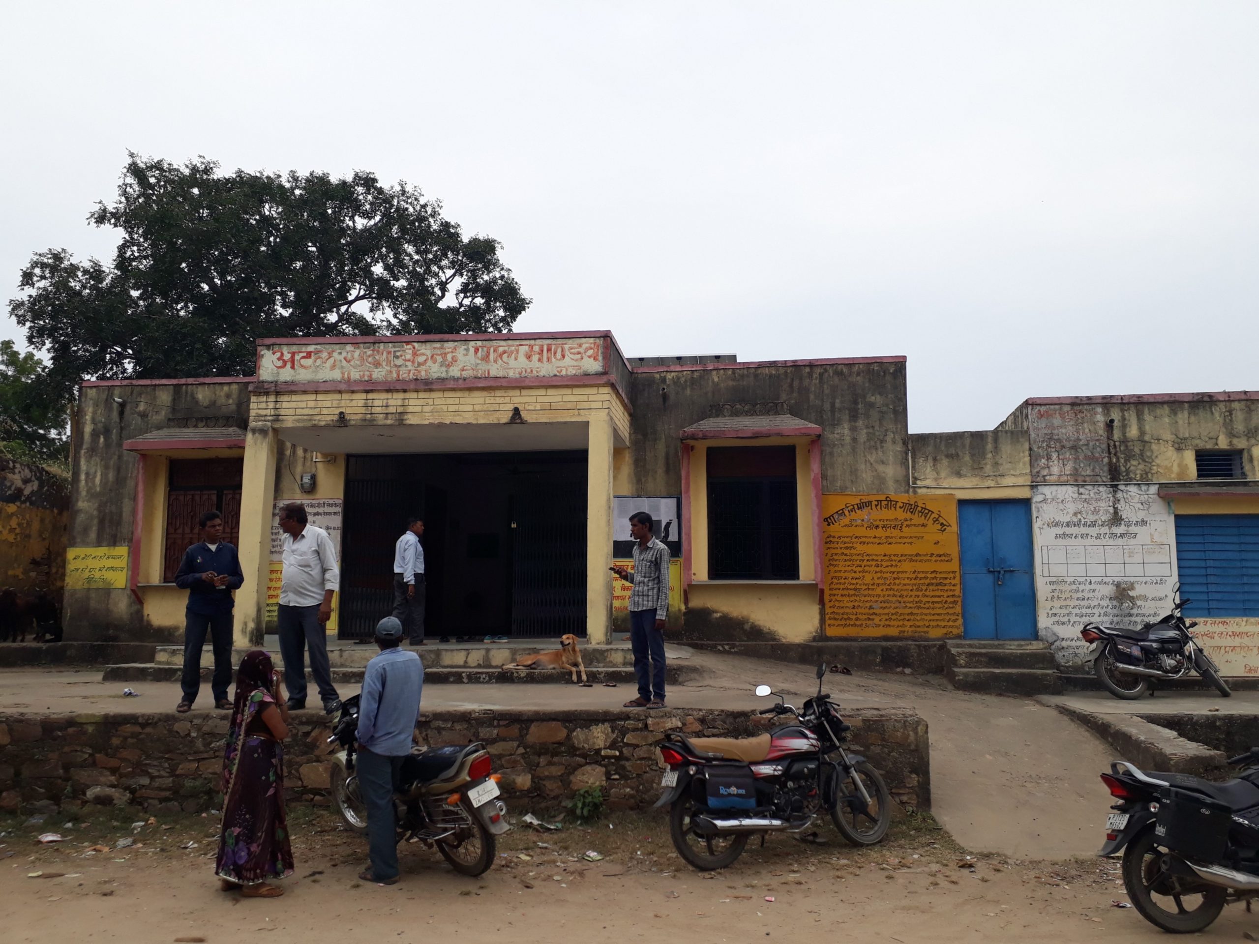People standing in front of a building-systems of local self-government in India