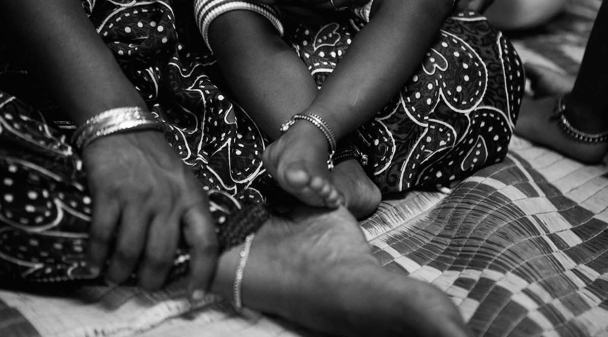 Hands and feet of a mother and child