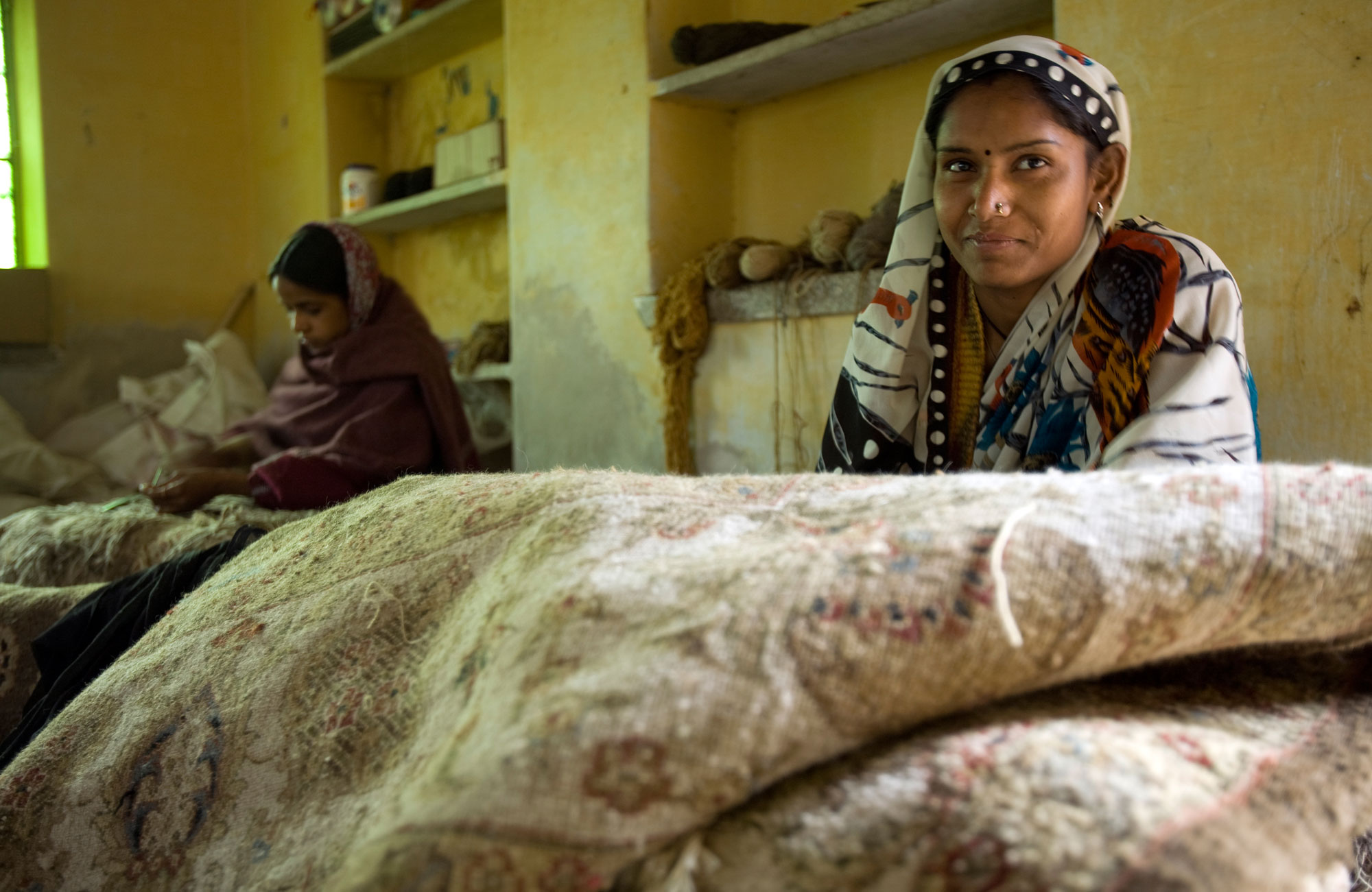 A woman in a cottage industry,stitching