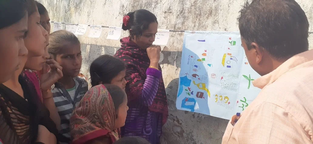 Munni Devi showing unsafe locations in the community-child protection