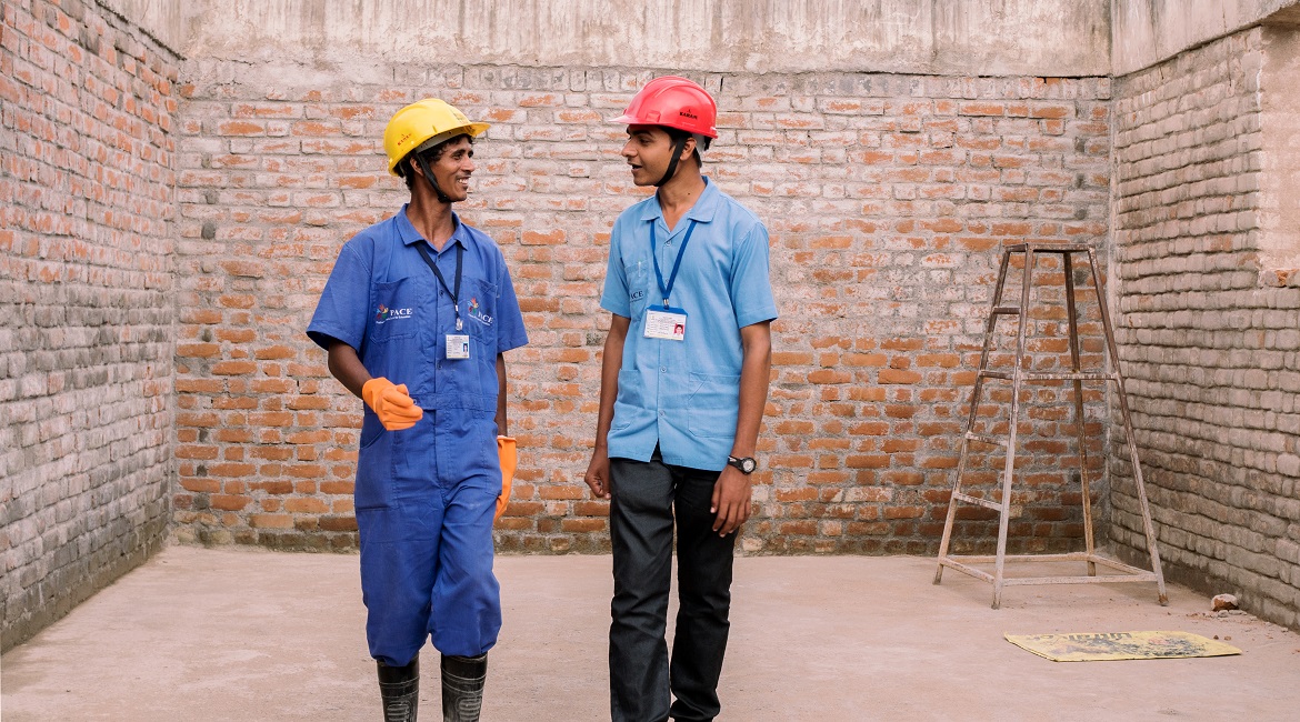 Two construction workers talking