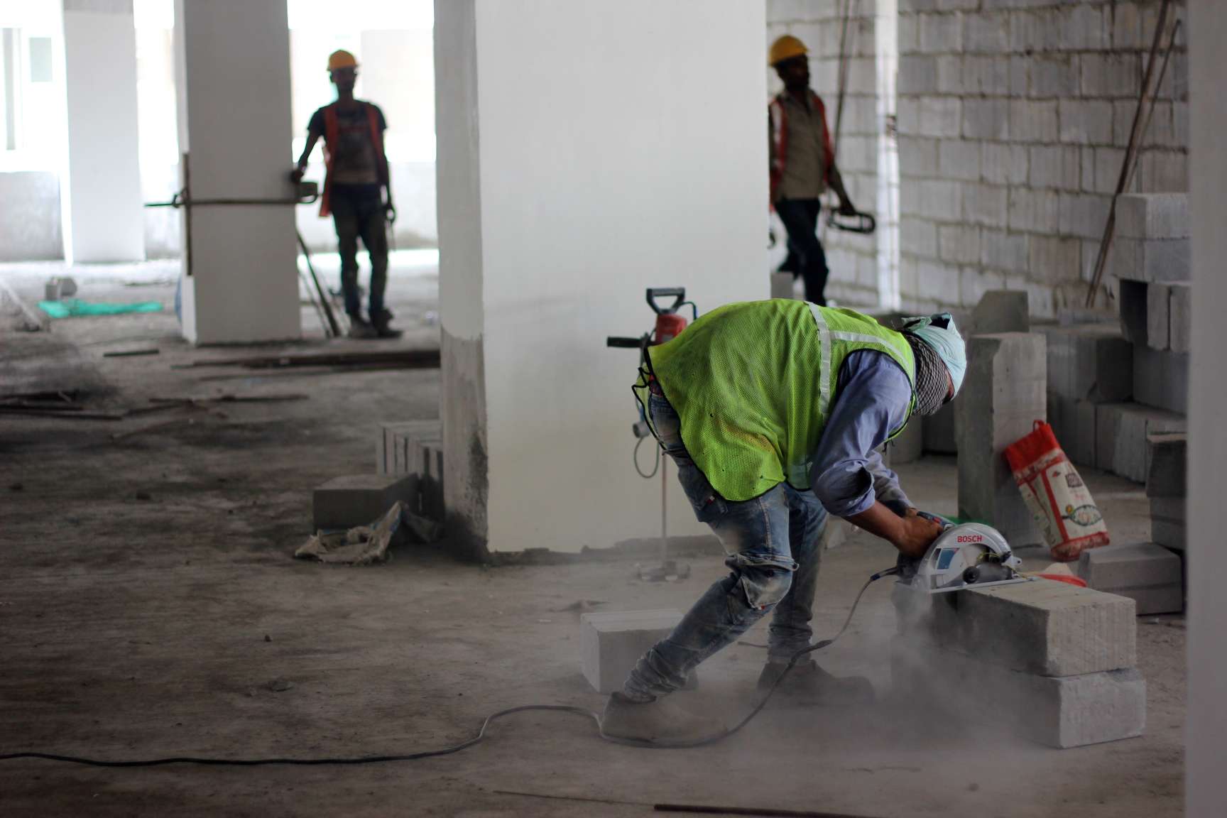 a construction worker working on an indoor worksite-construction workers welfare
