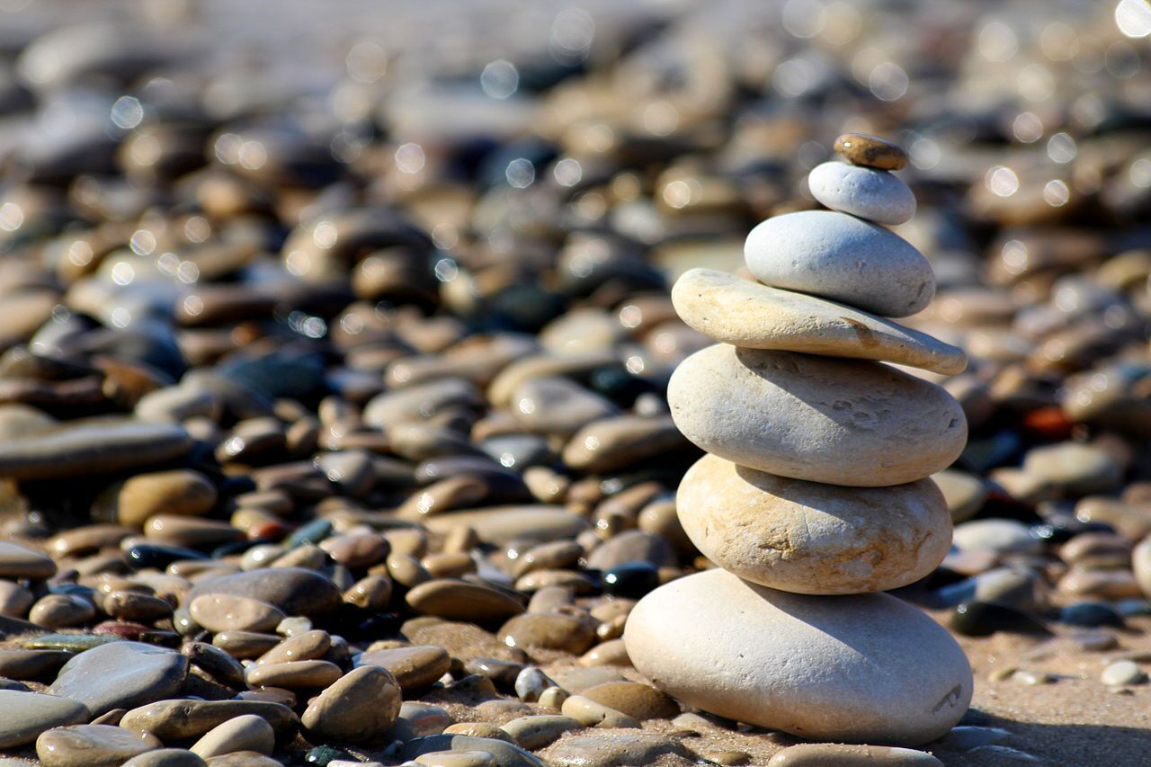 Stones stacked near a water body