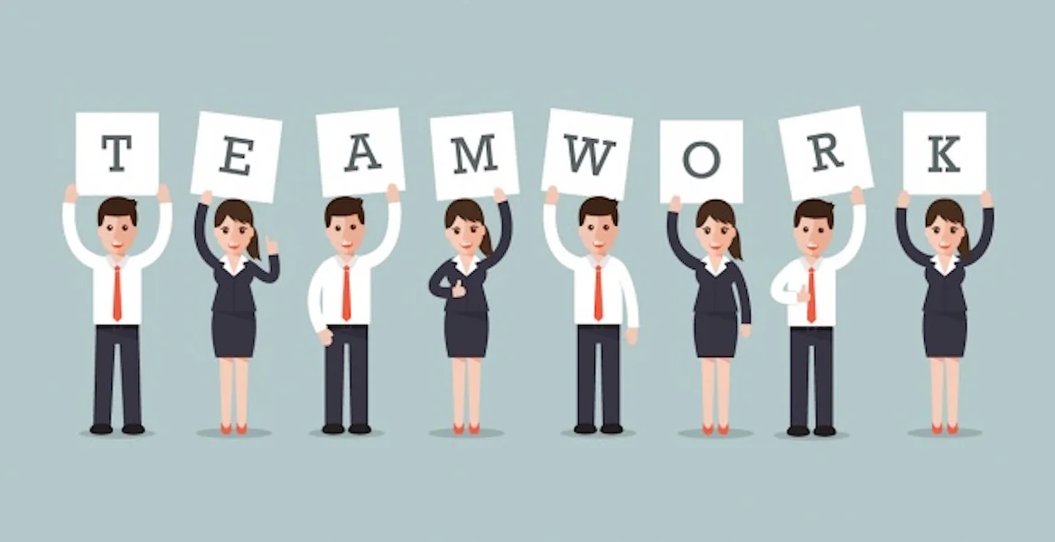 Business people holding up teamwork sign