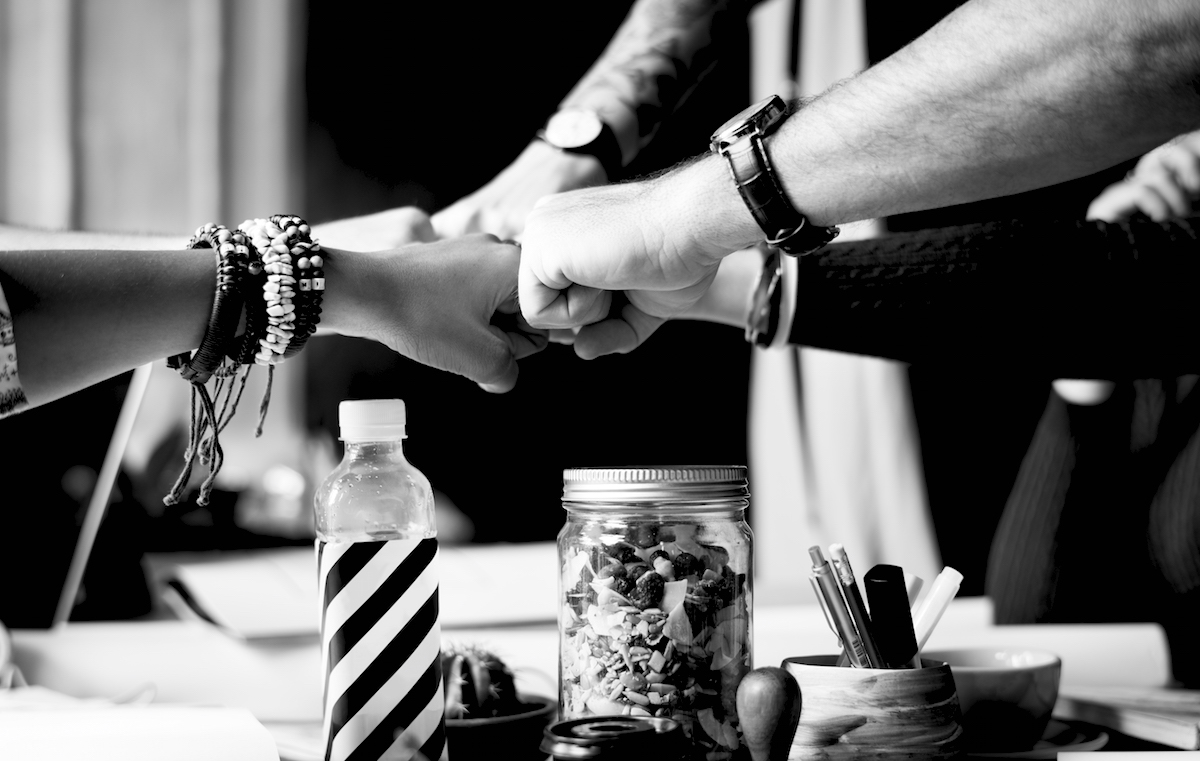 Business Colleagues Together Teamwork Working Office fist bumping