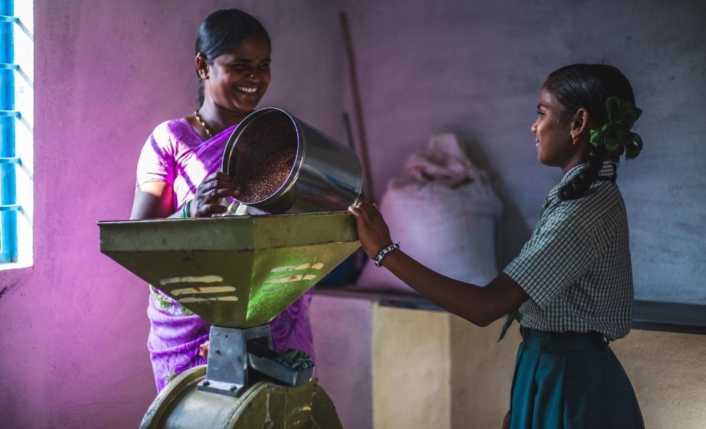 A woman and a girl processing food_rural livelihood_selco