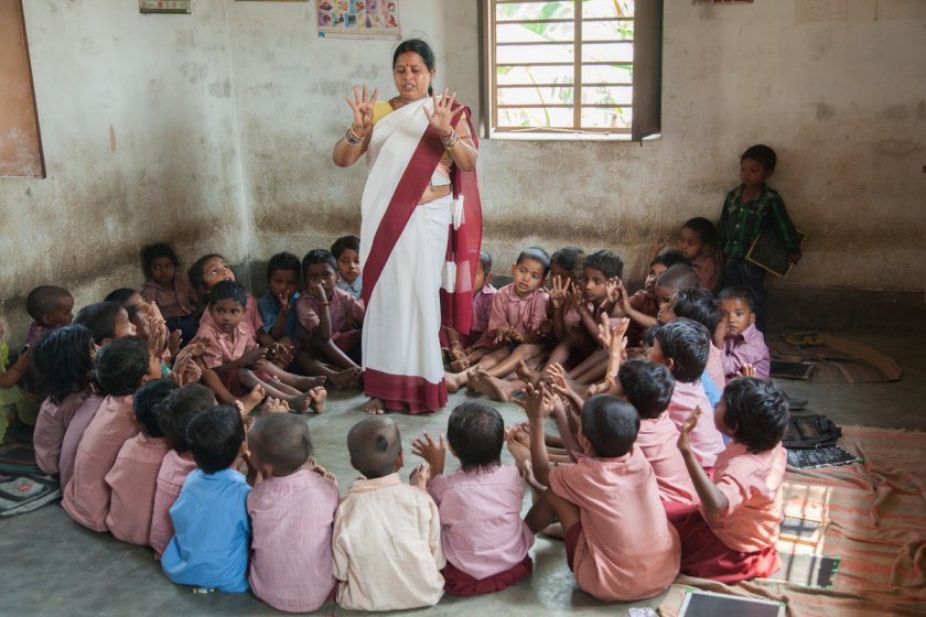 anganwadi worker teaching children-primary education