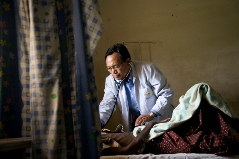 doctor attending to a patient-universal healthcare