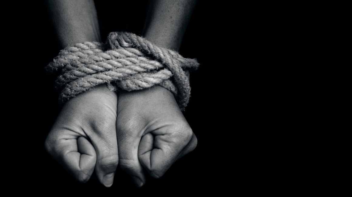 hands tied together with rope-restrict