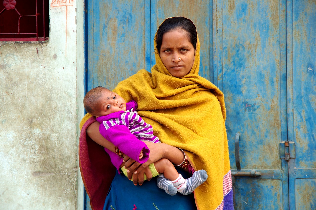 An Indian woman holding her child_Unsplash