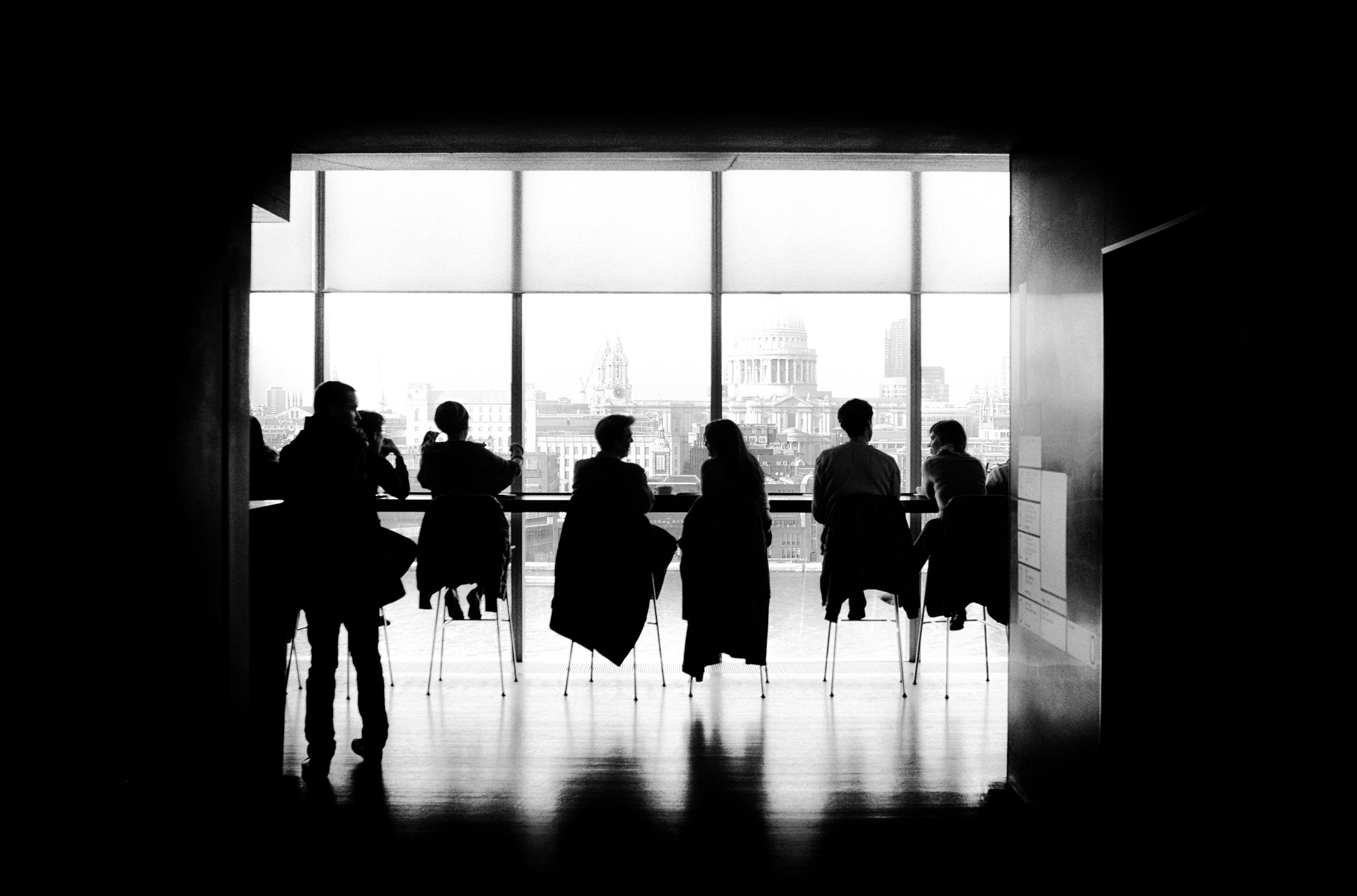 Several people sitting on chairs and talking