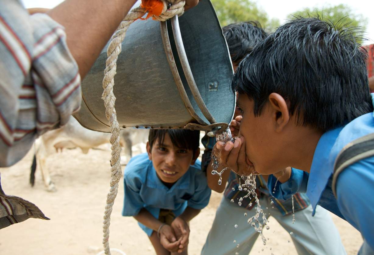 school boys drinking water-water