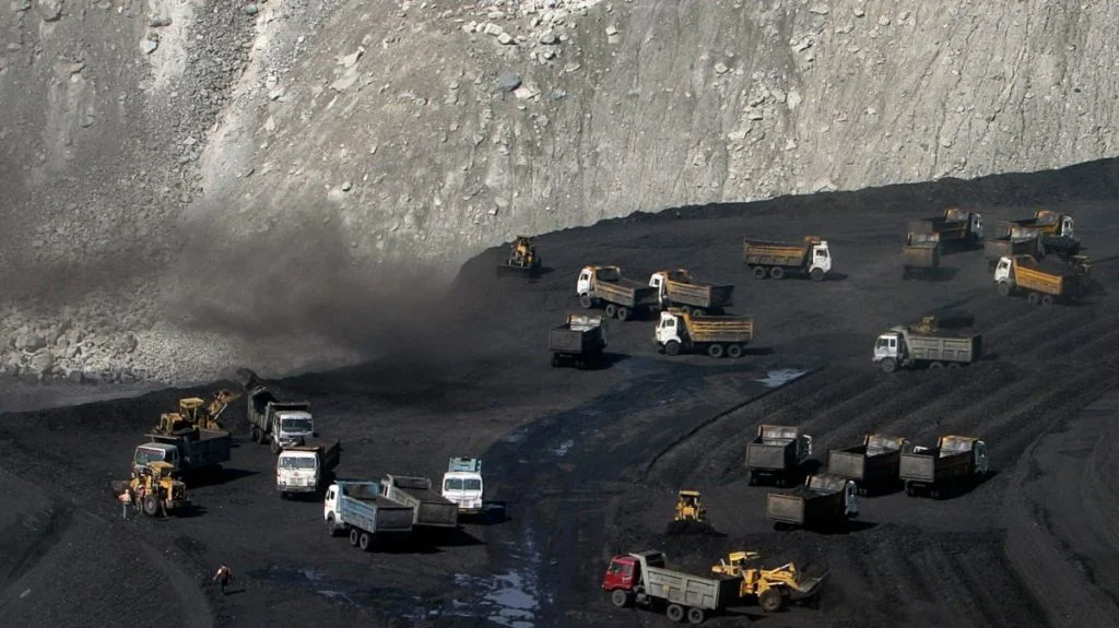 trucks on a coal field in India-Wikimedia Commons