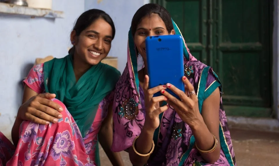 2 village women taking a selfie