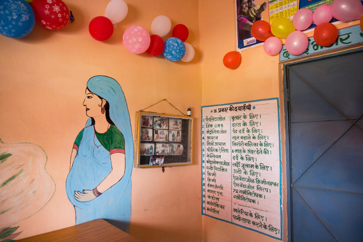 A painting of a pregnant woman in an Indian school classroom-PMMVY