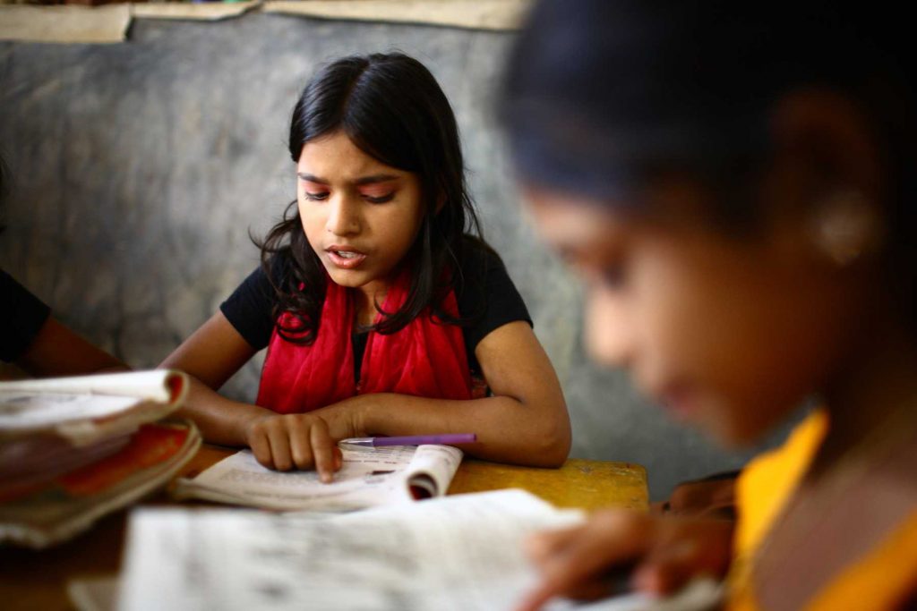 Two children studying at Unique Child learning Centres in Dhaka. Education programmes designed for low-income people often only focus on poverty. They must engage with the sociocultural and political aspects of marginality.