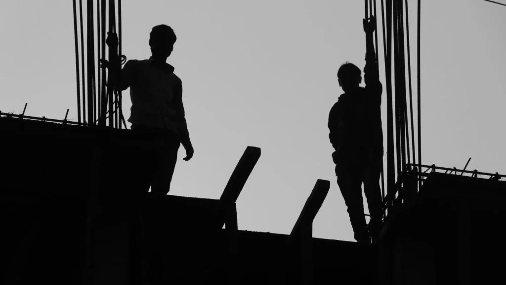 Migrant labourers at a construction site in Lucknow
