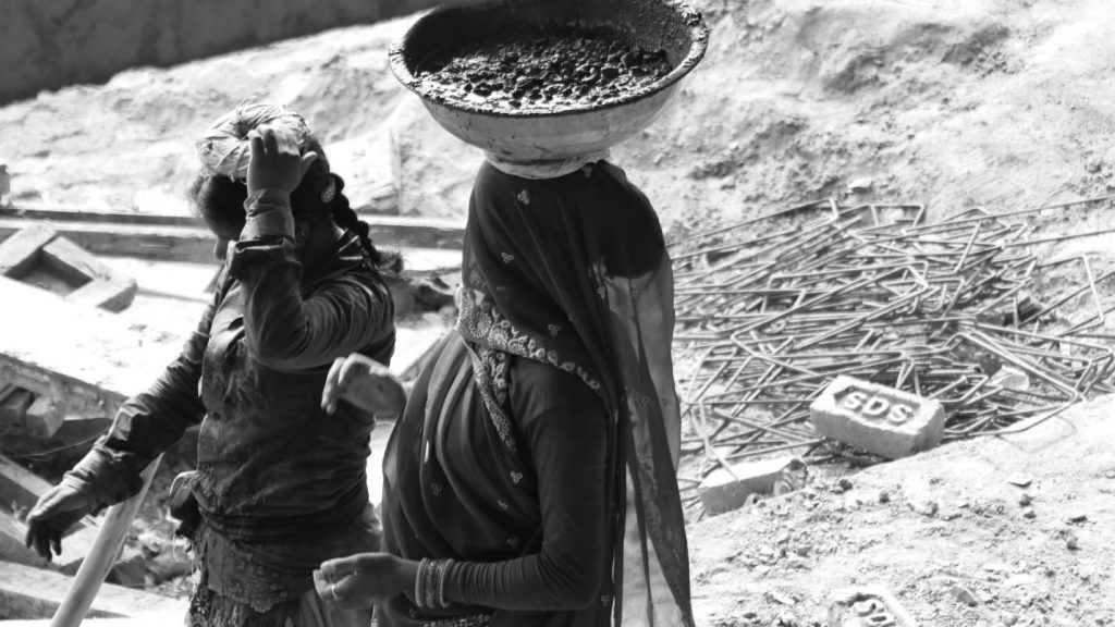 Migrant women do most of the digging, lifting and transporting material on construction sites