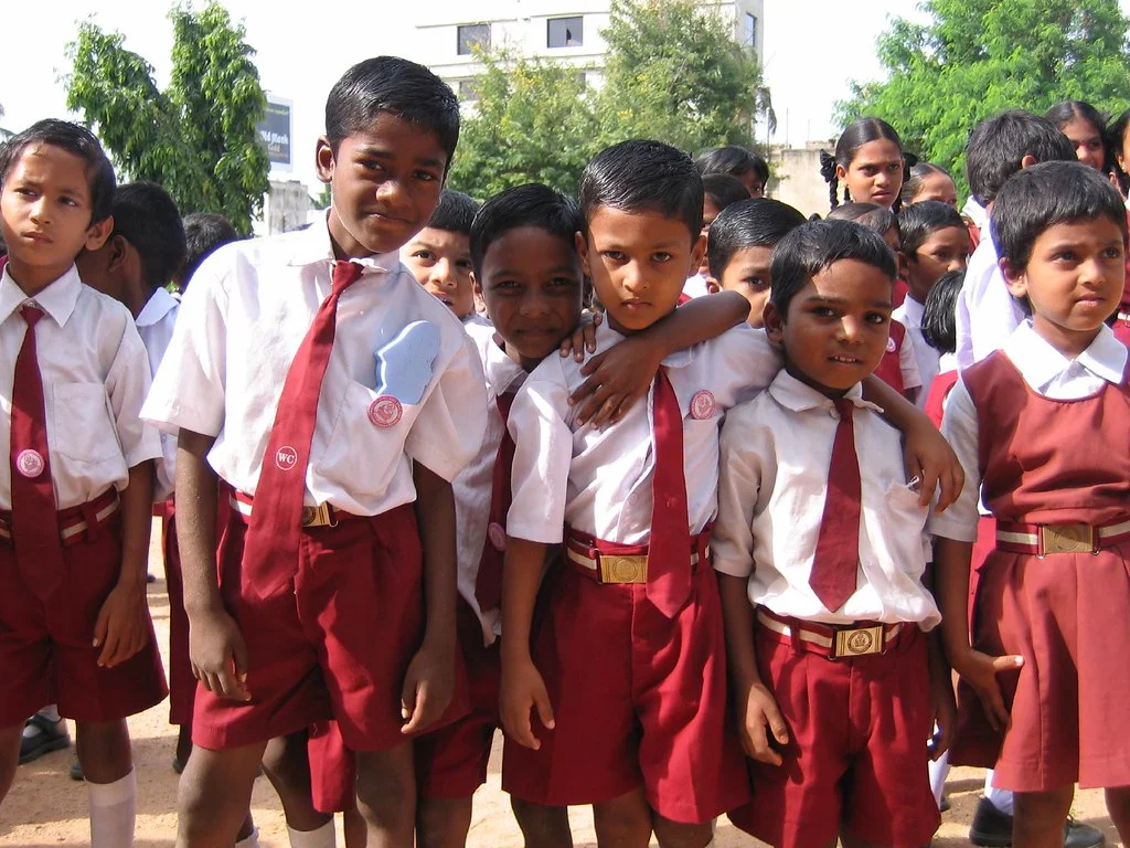 A group of young Indian boys in school uniform
