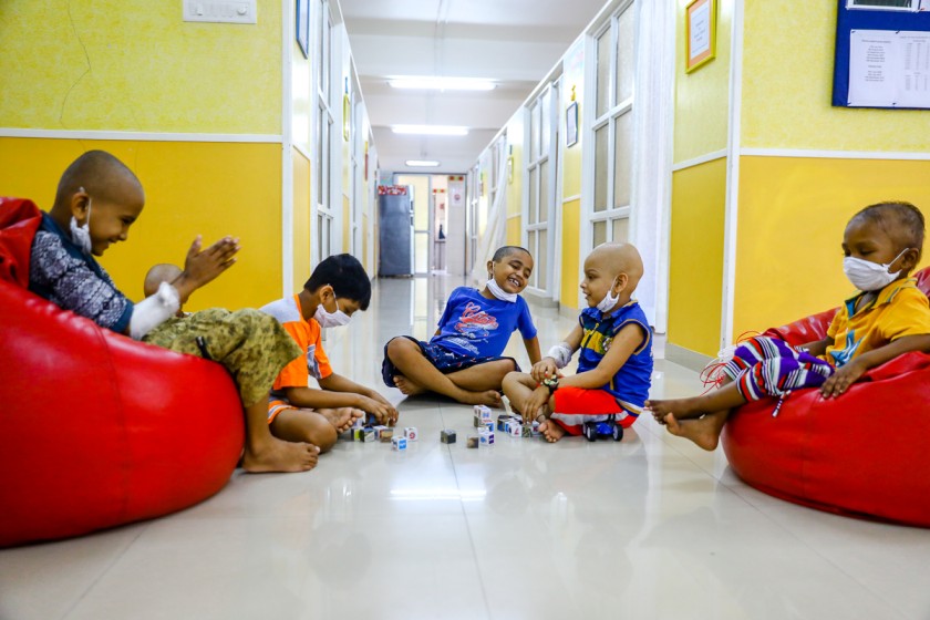 Group of children sitting together and playing-pediatric cancer