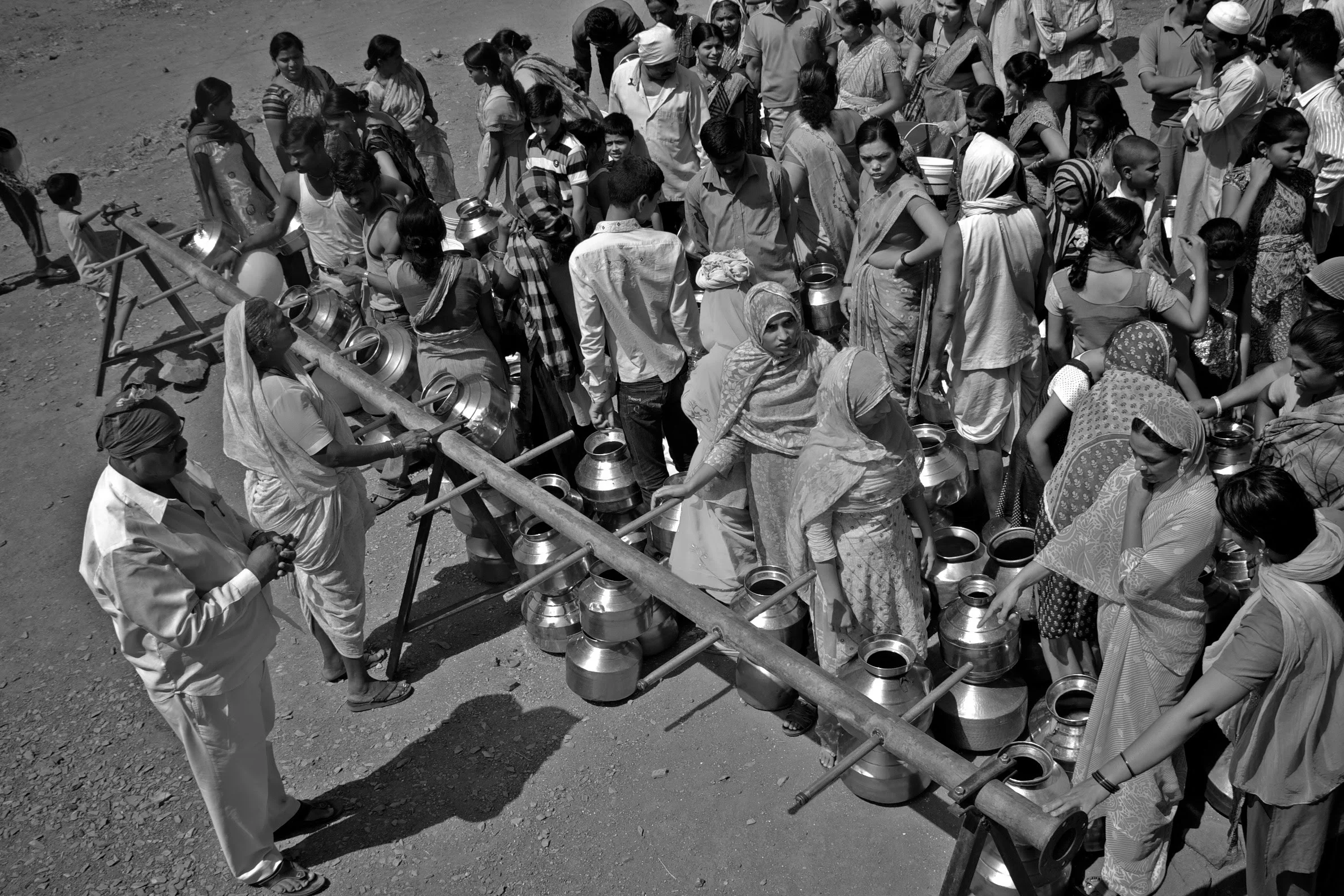 People waiting in line for water_ASwaminathan