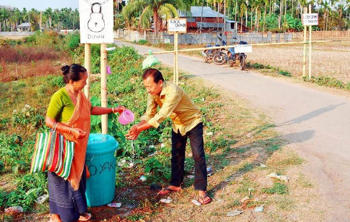 Villagers ensuring hand wash for outsiders in Bairagipara, Tripura