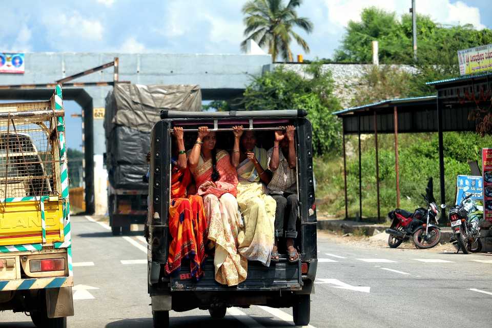 Women sitting at the back of a taxi in india-gender-sensitive