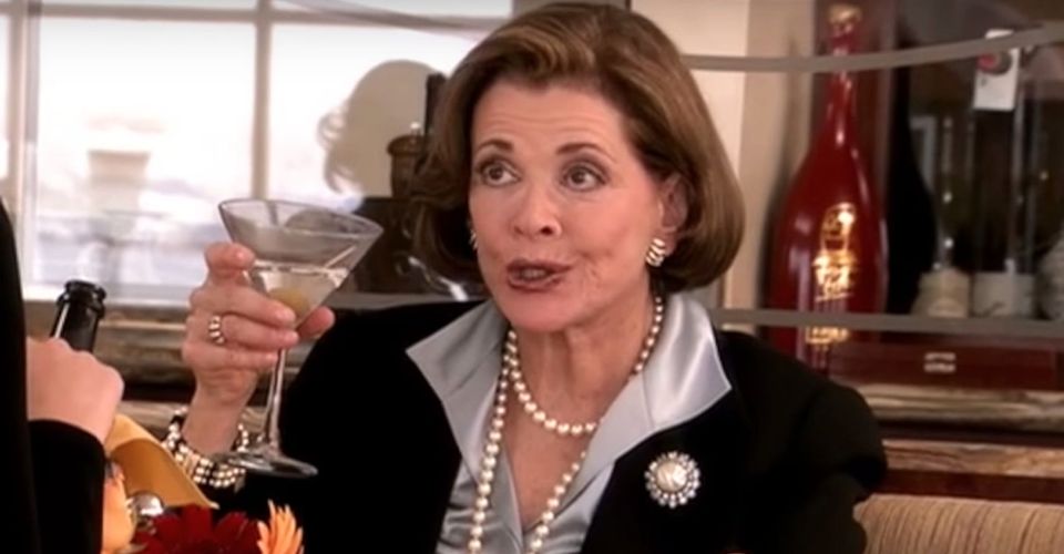 Lucille Bluth holding up a glass-Lucille Bluth