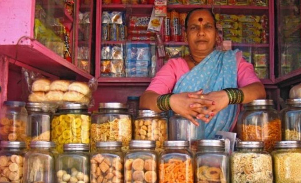 Woman selling snacks at a shop-overnutrition