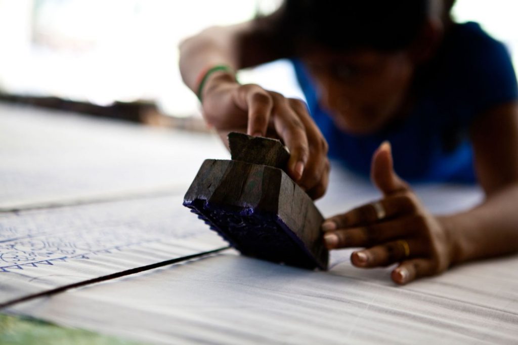 close up of a person block printing-vocational training