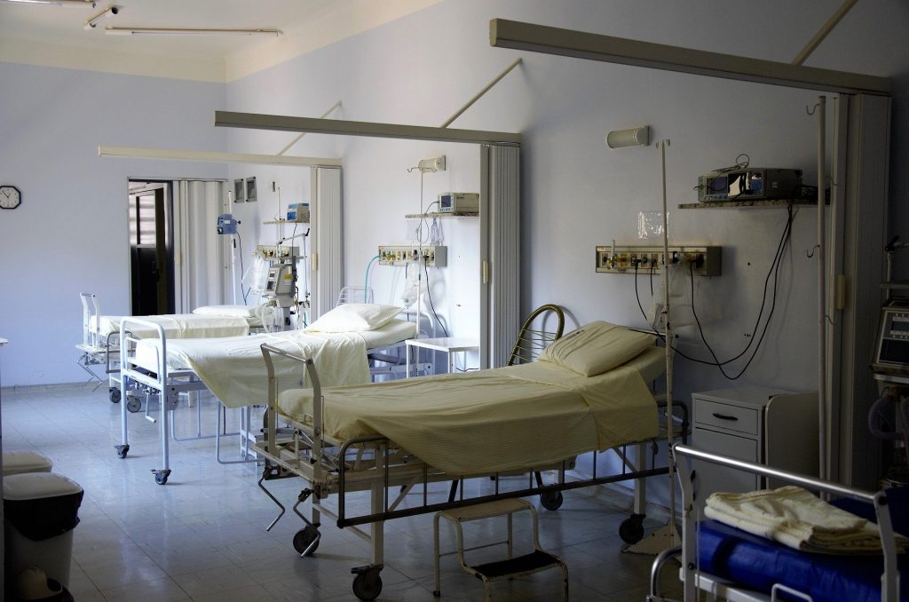 A room in a hospital with a line of hospital beds in India_healthcare