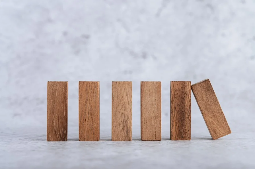 Wooden blocks lined up next to each other-impact investing