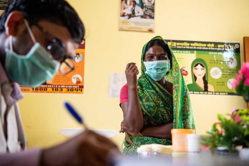 A woman at a community health centre in Uttar Pradesh during India's COVID-19 response