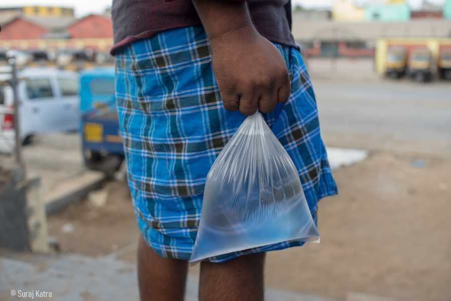 Image 11_ a person holding a clear packet of water_picture courtesy-Suraj Katra