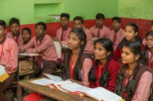 young-school-students-sitting-in-a-classroom-gender norms