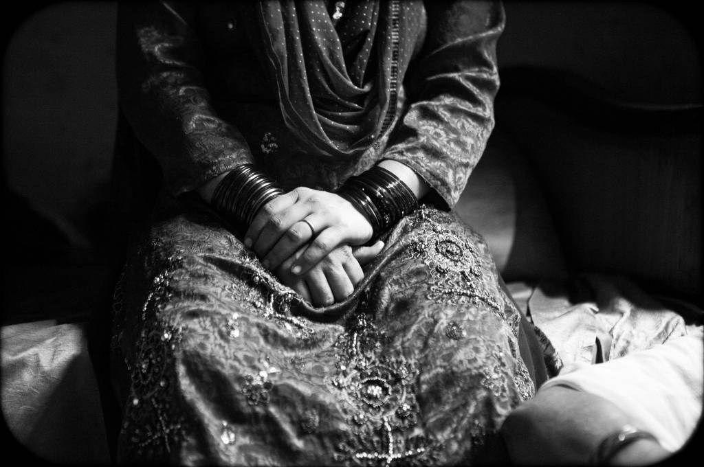 black and white photo of a woman with hands on top of each other. Picture credits: Charlotte Anderson-grief and death children