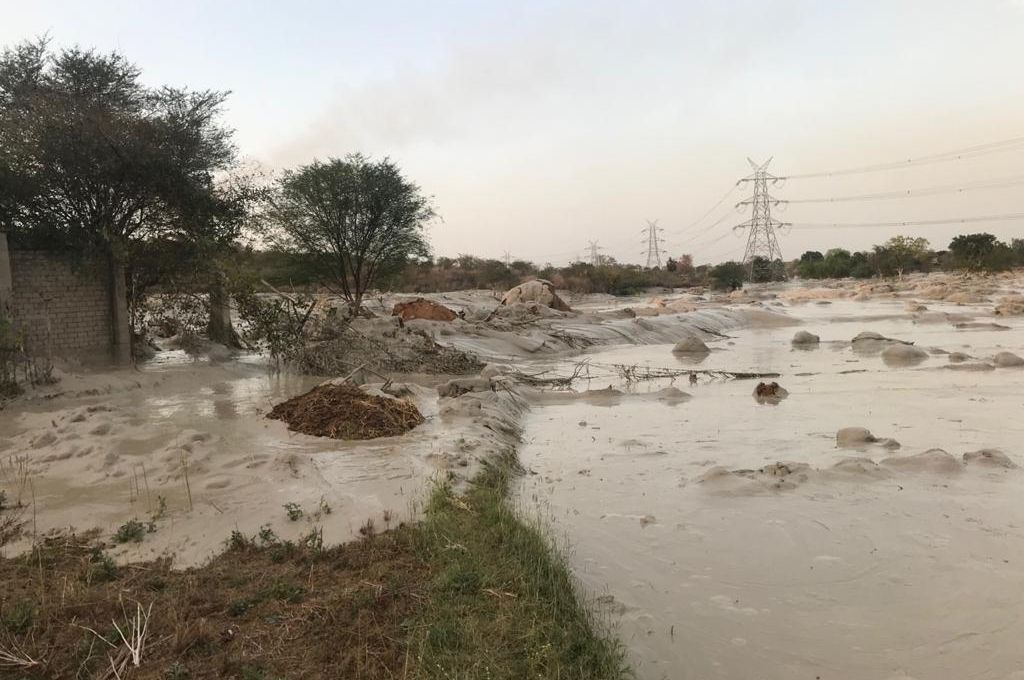 Flyash flooding fields in the aftermath of the Reliance Sasan Ultra Mega Power Project breach at Sasan-