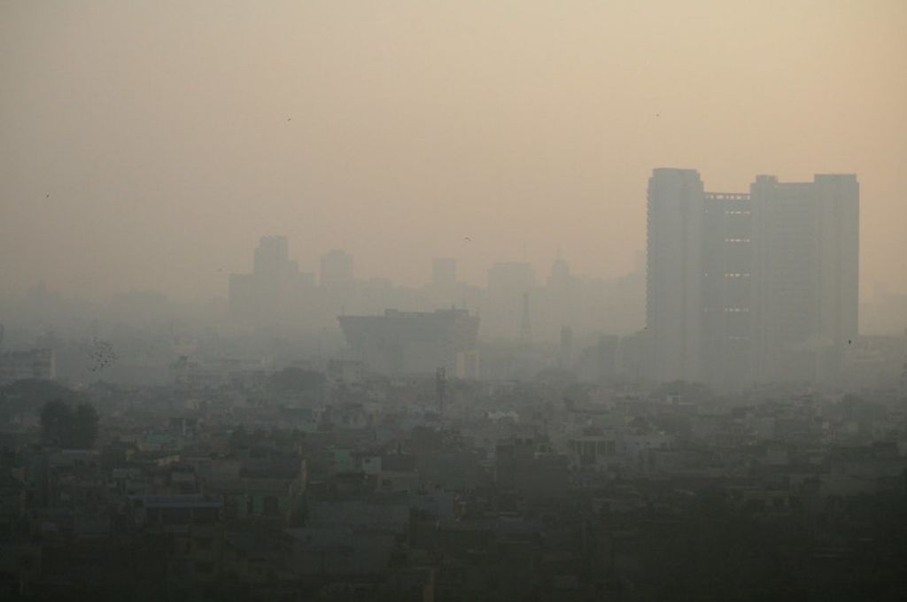 A building behind a haze of smog. In India, economic losses from air pollution were equivalent to 1.36 percent of the country’s GDP