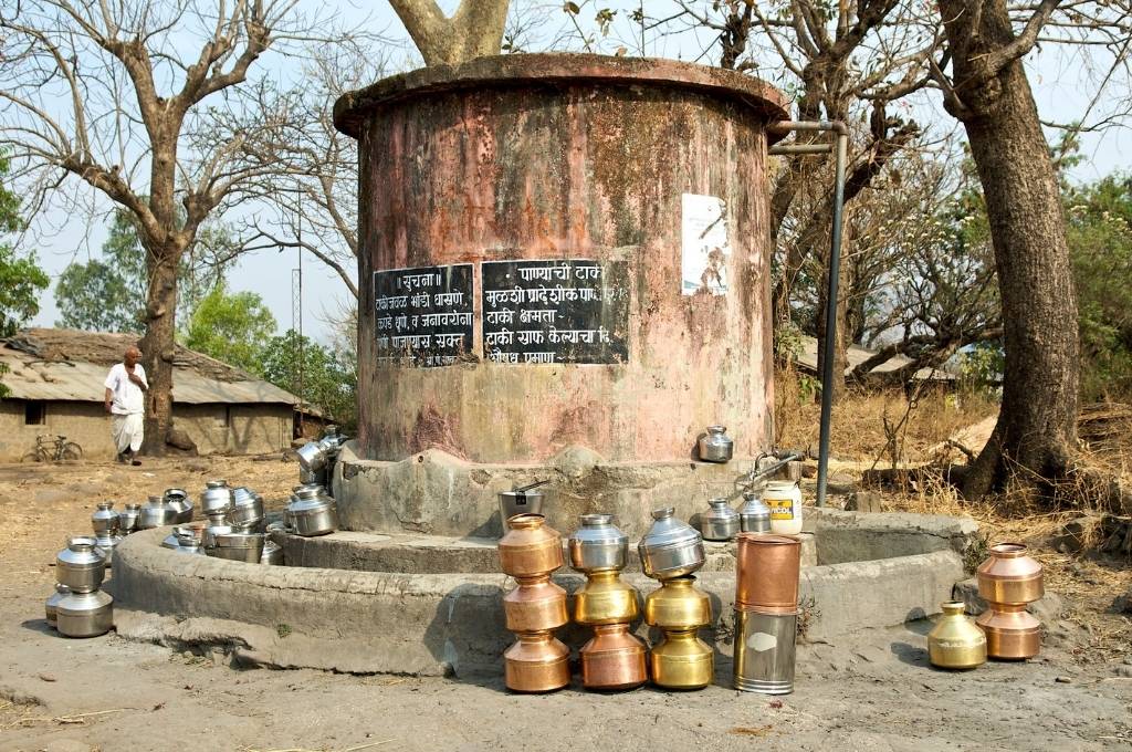 water containers outside a well-water security