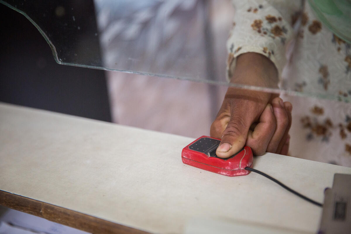 close up of a woman giving her biometric data-aadhaar