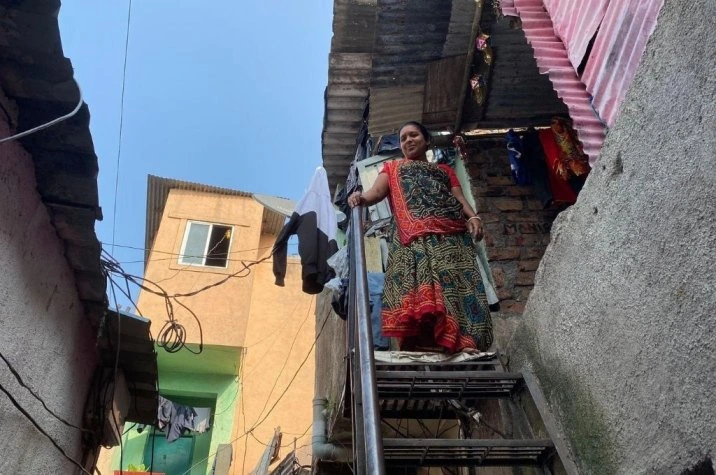 Woman standing at the top of steps