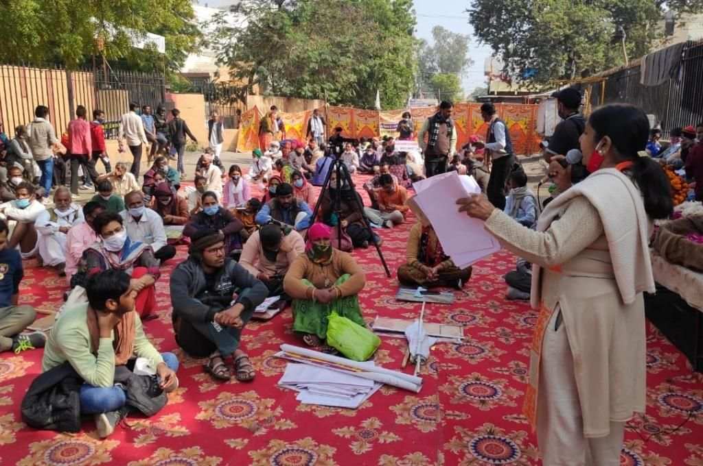 A speaker addressing the crowd at the Jawabdehi Yatra assembly