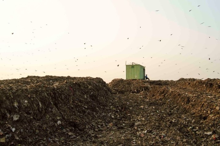 The watchman, Mr. Dubey, watching over the Ghazipur landfill near New Delhi-waste management
