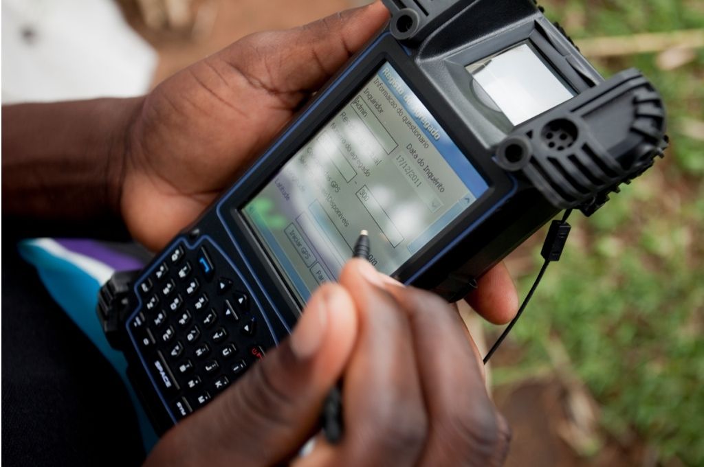 man using tech for data collection