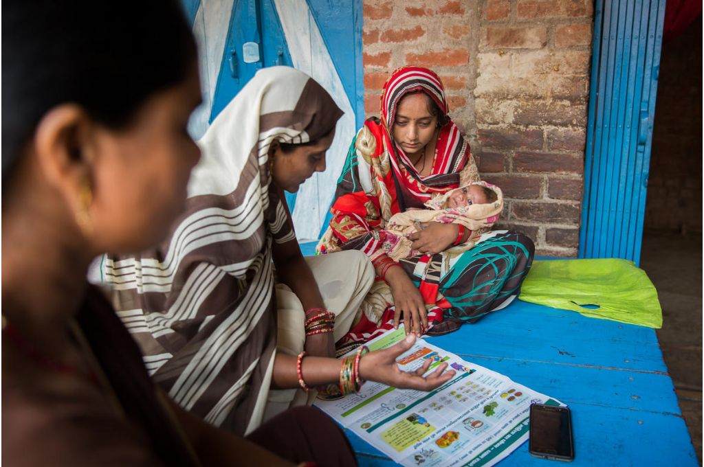 women looking at a health chart - maternal mortality rate