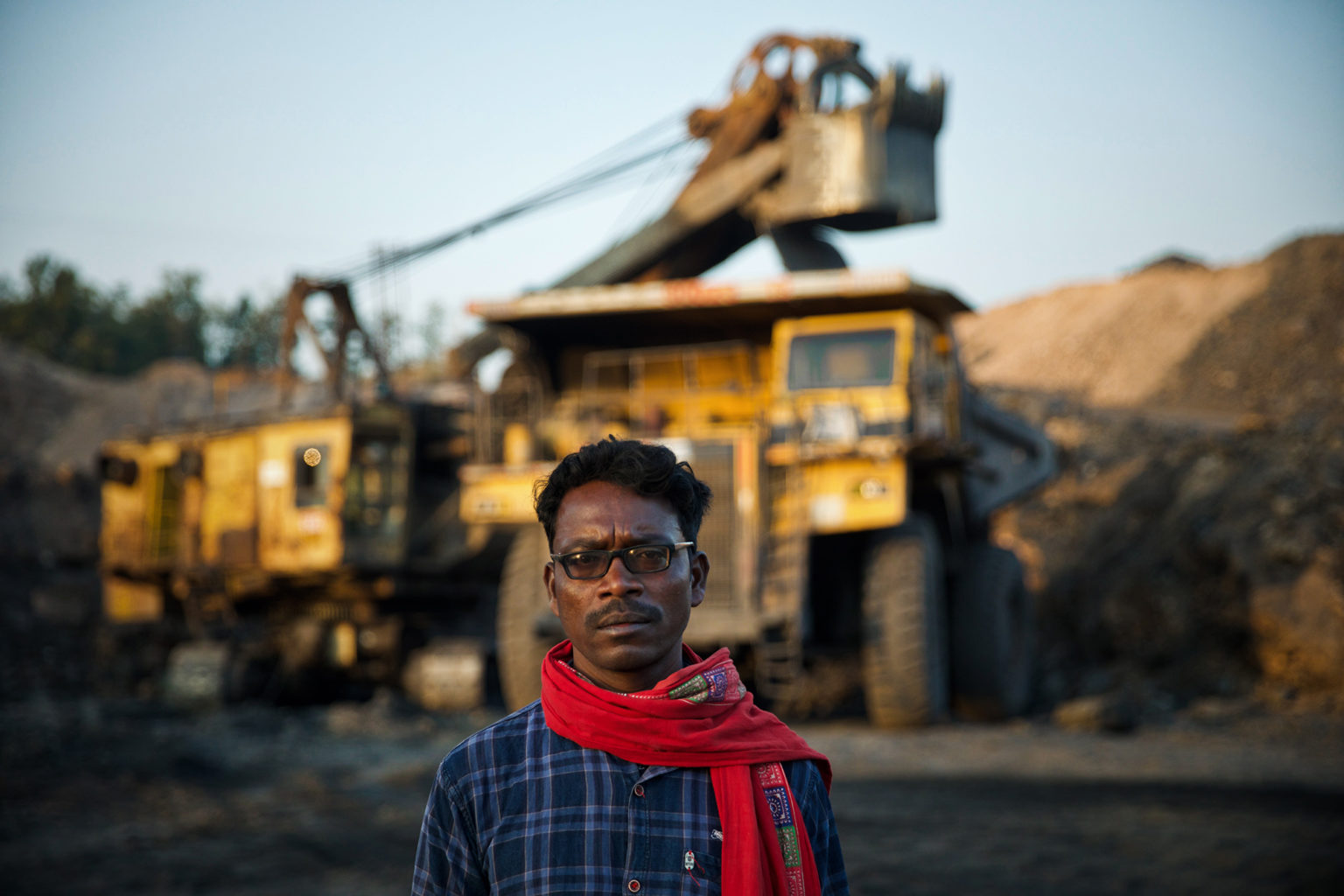 A photo of a man at a coal mining site